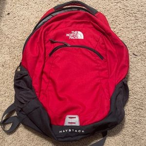 Red North face haystack backpack